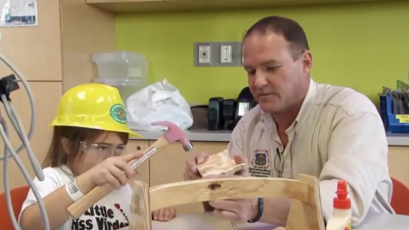 Kids building toolboxes with Carpenter assistance