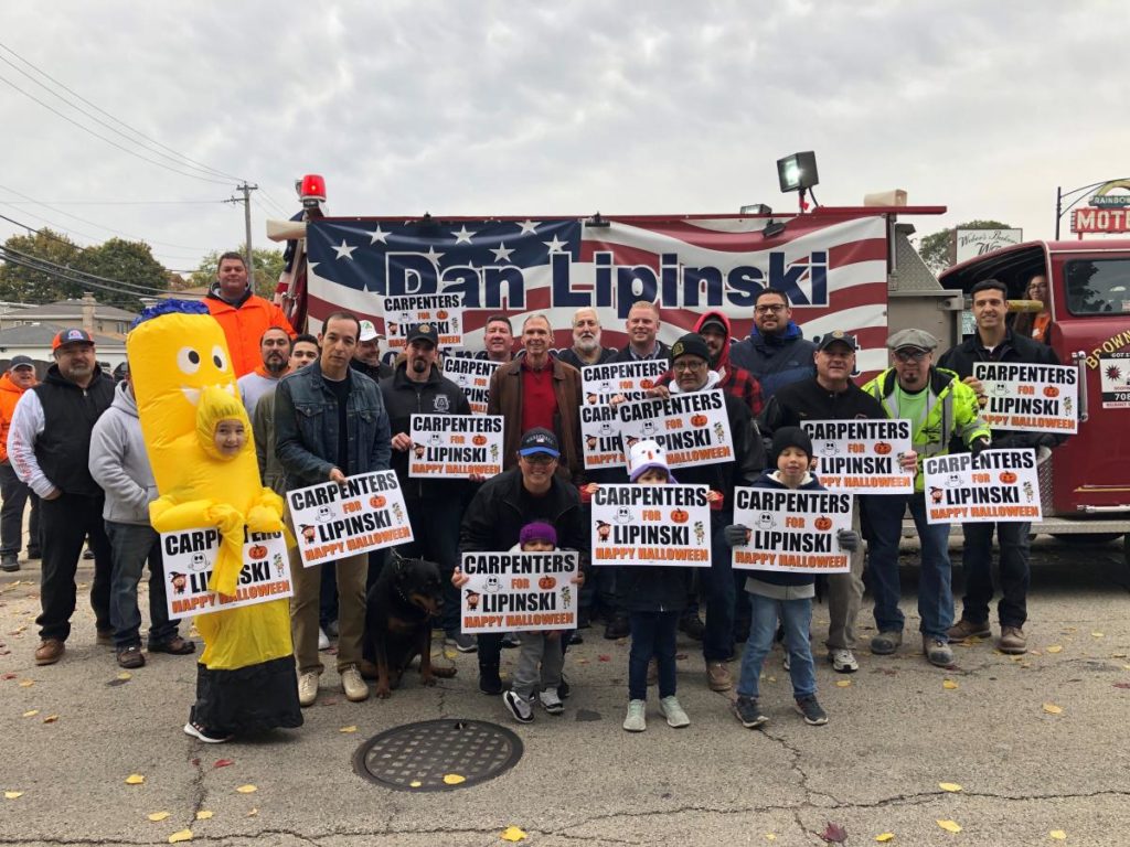 Group of Carpenters with Lipinski signs at Pumpkin Parade
