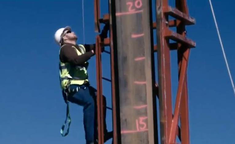 Construction worker on a ladder