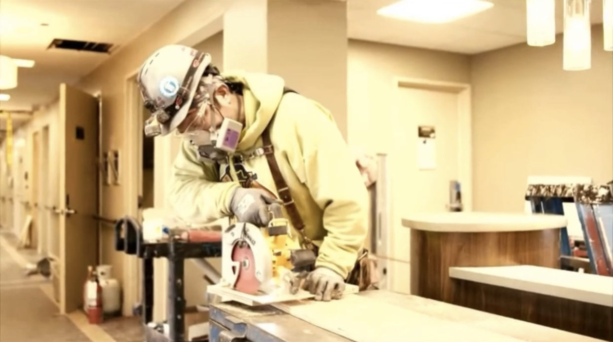 carpenter with saw