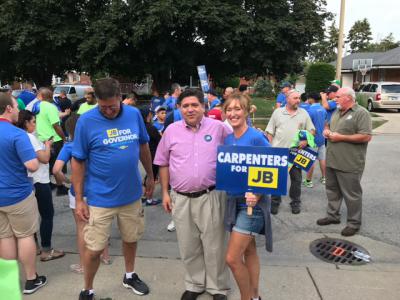 Pritzker walks with supporters in Evergreen Park Independence Day Parade