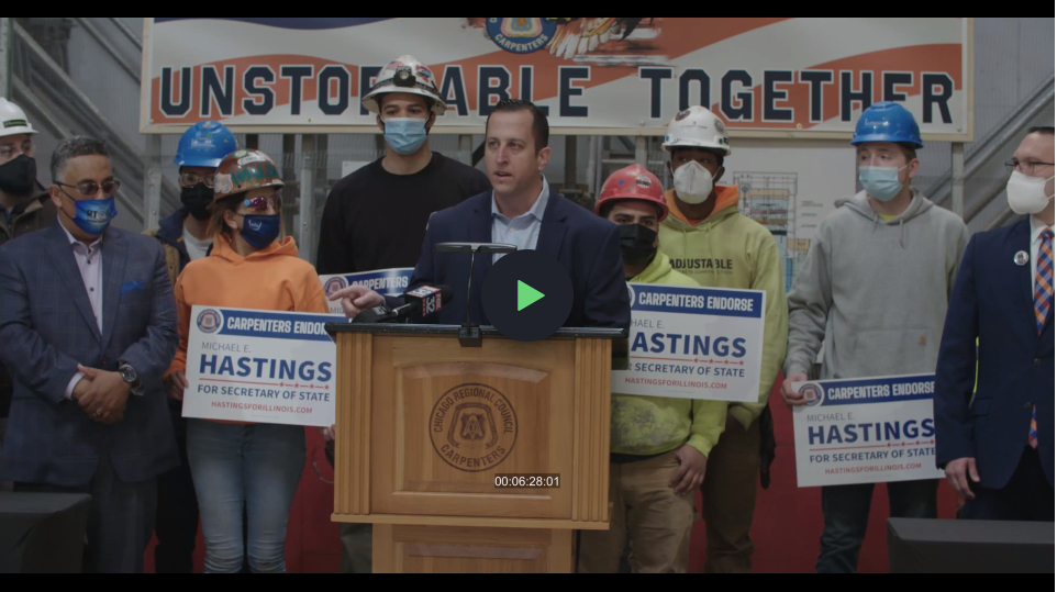 Senator Mike Hastings speaks with carpenters