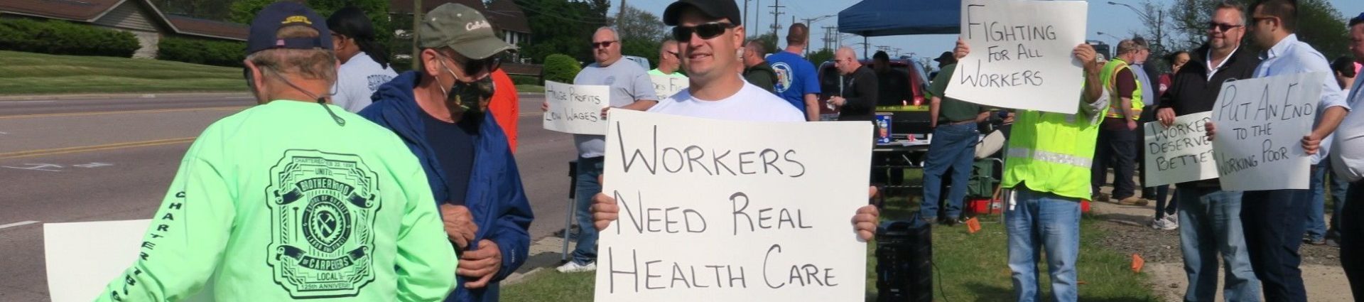 Construction Workers at rally with signs