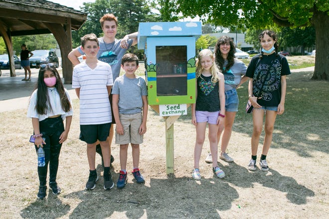 Rockford kids pose with a little seed library