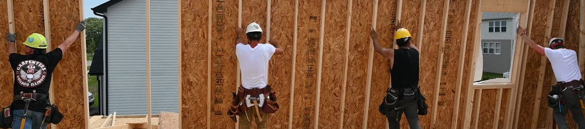 4 carpenters building a house