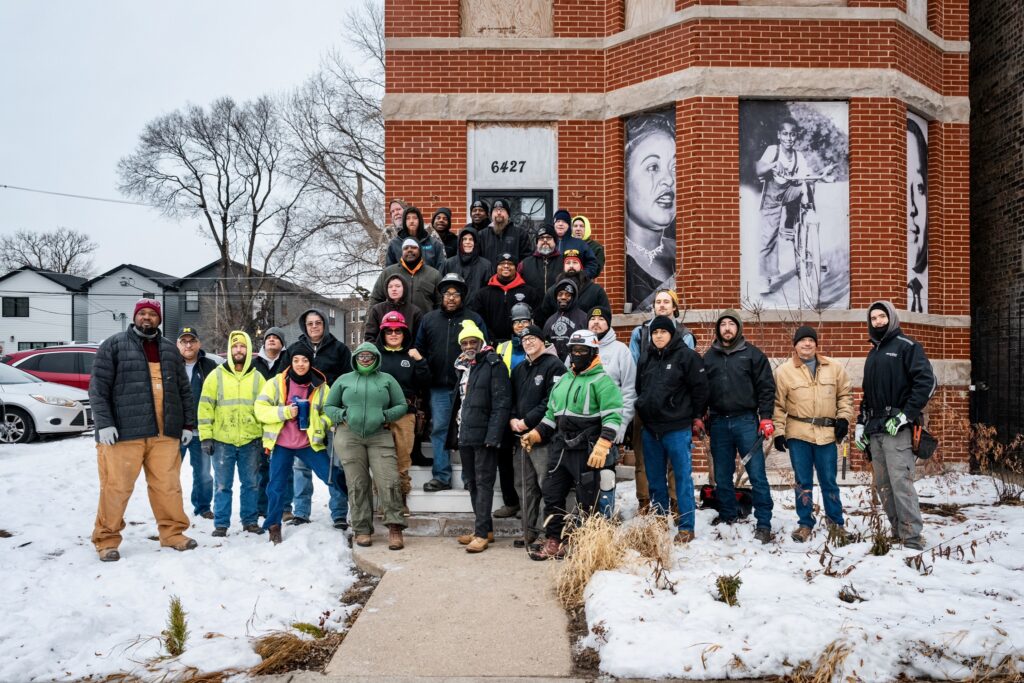Union carpenters pose in front of the Emmett Till home and museum.